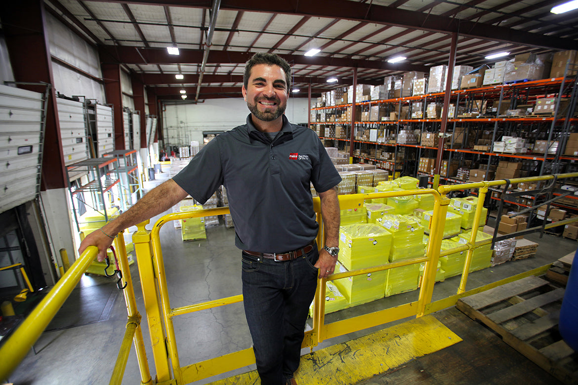 a person (Seth Glauberman) standing in a warehouse