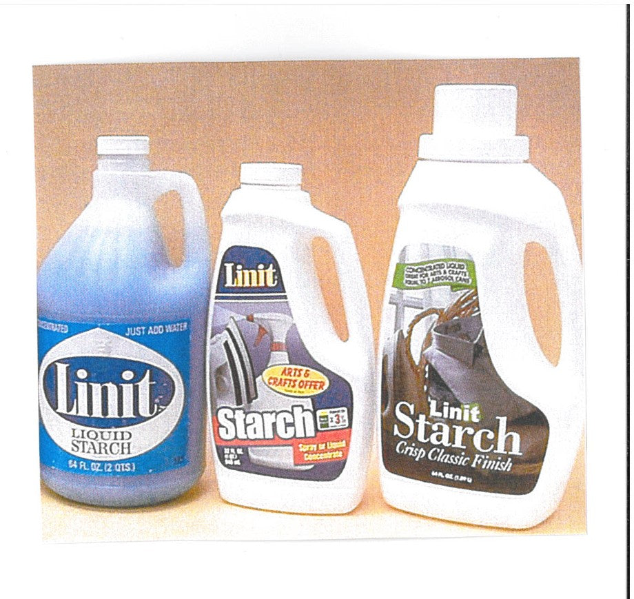 a group of white LINIT STARCH bottles 