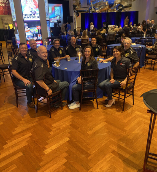 a group of people sitting at a table