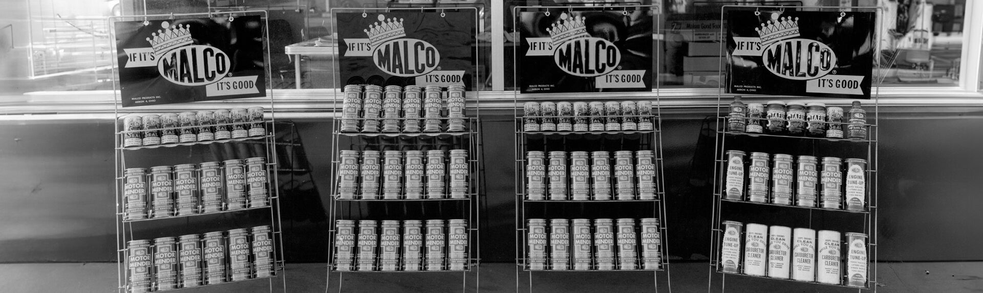A row of MALCO cans on display
